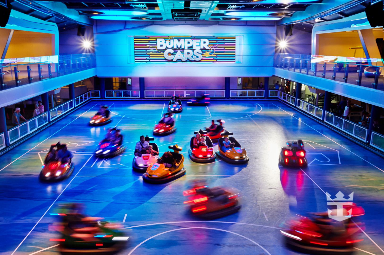 Shot of passengers riding in bumper cars onboard Quantum of the Seas